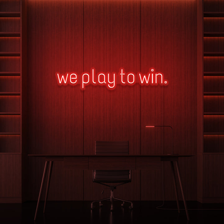"WE PLAY TO WIN." NEON SKILT